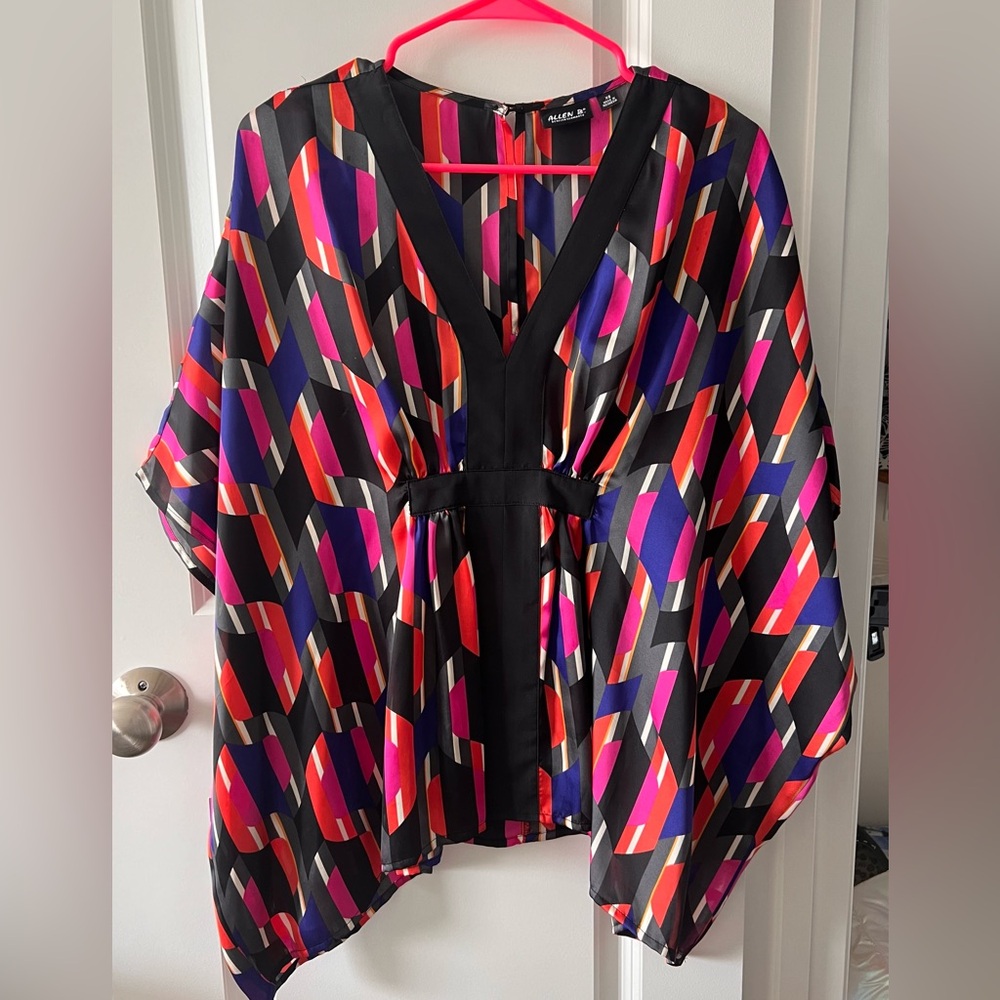 Silky tunic, labeled XS, can fit many sizes